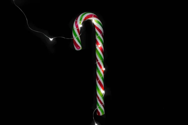 Christmas Candy Cane Turned Illuminated Garland Isolated Black Background — Stock Photo, Image