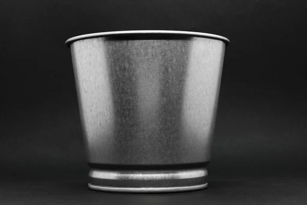 Aluminum bucket with copy space on grey background surface