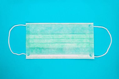 Sağlık ve Tıp. Mavi arka plan üzerinde tıbbi koruyucu maske