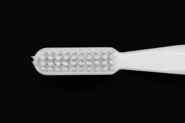 White toothbrush isolated on black background — Stock Photo, Image