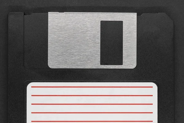 Siyah arka plan üzerinde siyah disket — Stok fotoğraf