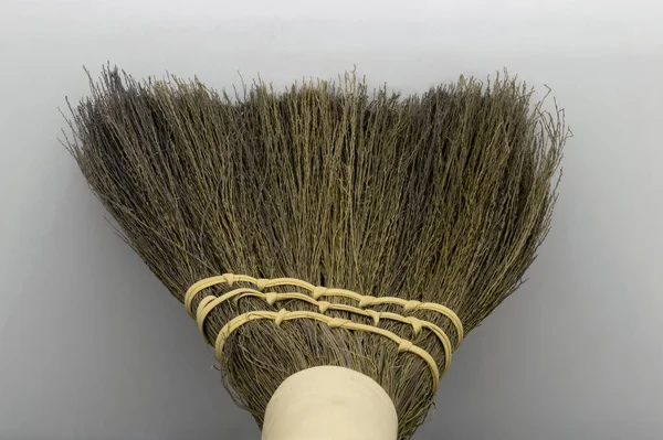 Straw broom on grey background — Stock Photo, Image