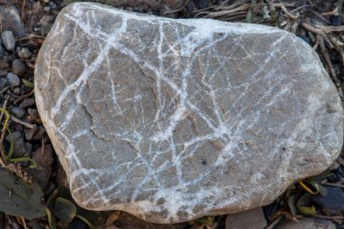 Grafhic çizgileri düzgün taş. Gri çakıl arka plan. Doğal taş grafik satırlarında. Doğa kaba malzeme. Doğal mineral kavramı. 