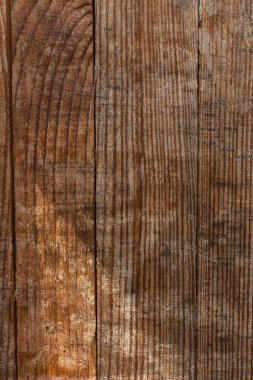 Eski ahşap doku, dikey. Grunge tahta tahtaları. Eskimiş ahşap duvar kağıdı. Eski, kirli kalaslar. Tahta yüzey. Kahverengi odun.
