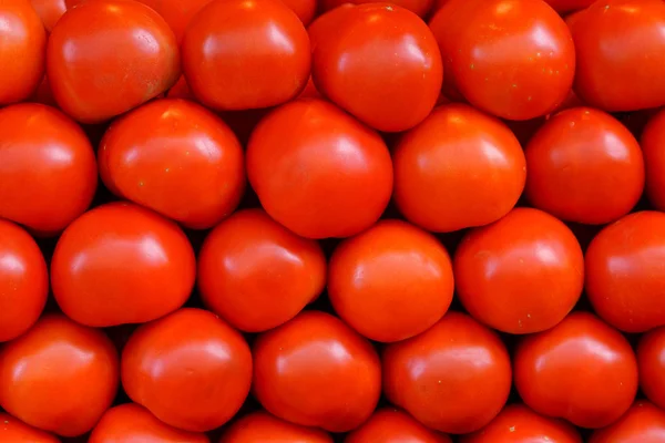 red tomatoes at the market, close-up