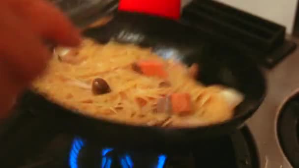 Woman Cooking Delicious Pasta Salmon Mushrooms Black Frying Pan — Stock Video