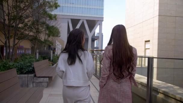 Two Attractive Friends Walking Rooftop Large Shopping Mall Slow Motion — Stock Video