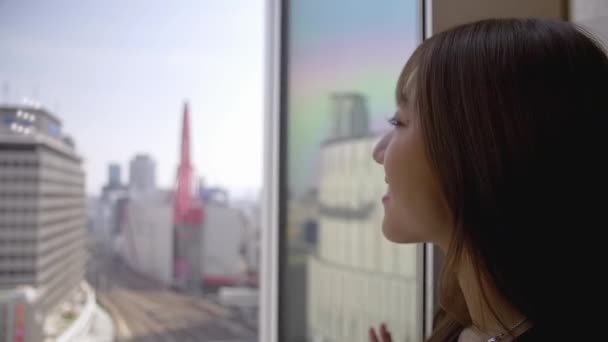 Attractive Young Japanese Woman Looking Out Window High Rise Building — Stock Video