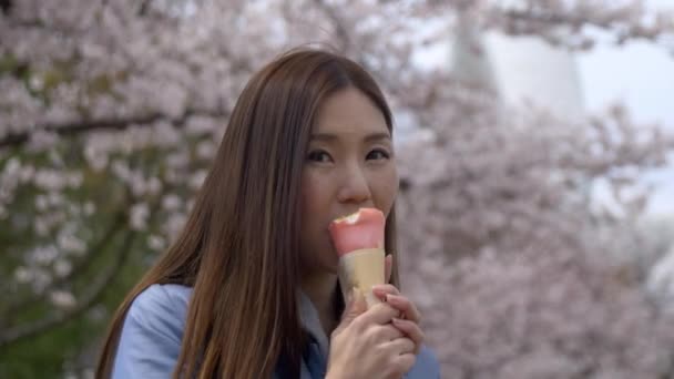 Portrait Cute Japanese Woman Eating Delicious Street Food Cherry Blossom — Stock Video