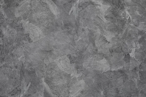 Özel bir boyadan yapılmış gri çimento arkaplan resmi malayla kaplıdır ve çıplak beton gibi bir yüzey elde eder..