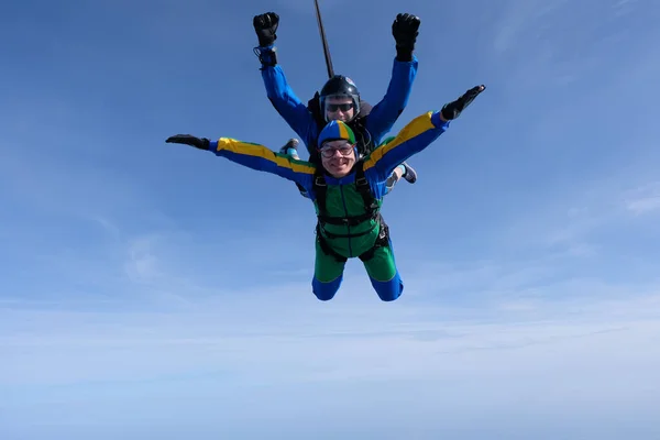 Skydiving. Tandem jump. Two guys are in the sky.