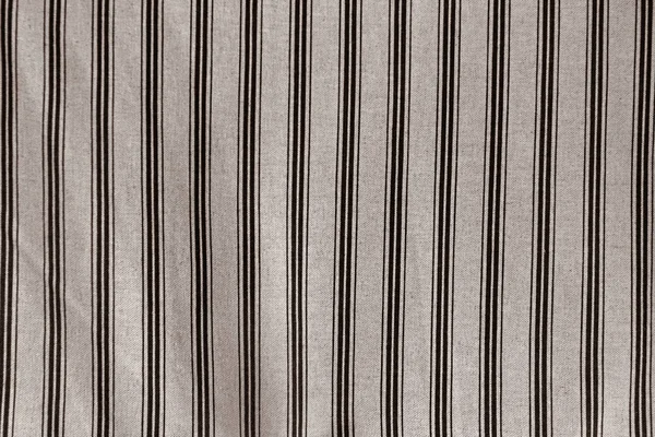 light linen fabric in a fine and wide black strip used for tablecloths, drapes