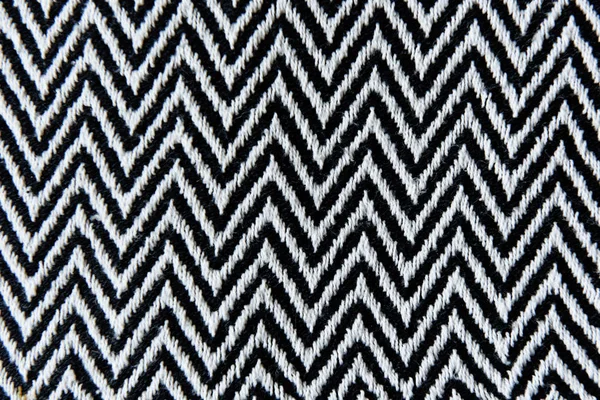 light linen fabric in a fine and wide black strip used for tablecloths, drapes. light coarse coarse linen cloth in a wide black strip used for tablecloths, bedspreads and carpets