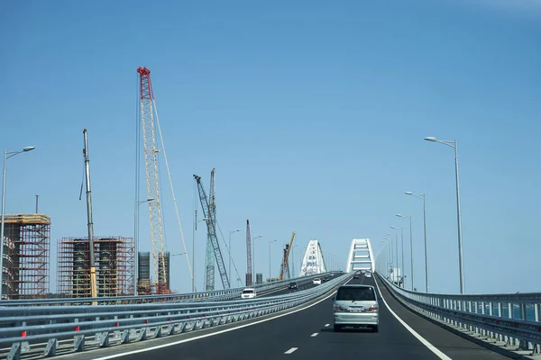 Cars go on the Crimean automobile bridge connecting the banks of the Kerch Strait: Taman and Kerch