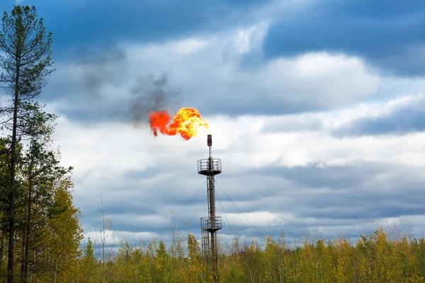 Gas torch on the background of the cloudy sky — Stock Photo, Image