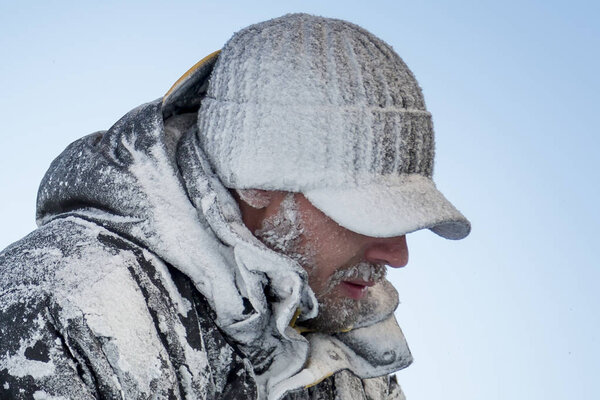 Close-up of a man with hoarfrost face