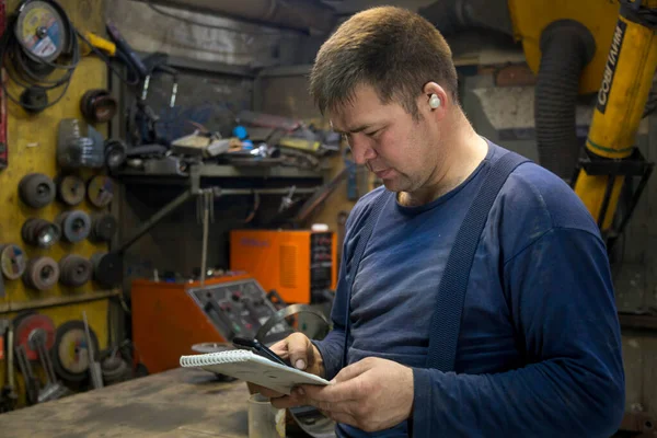 Portrait of male worker close up at workplace