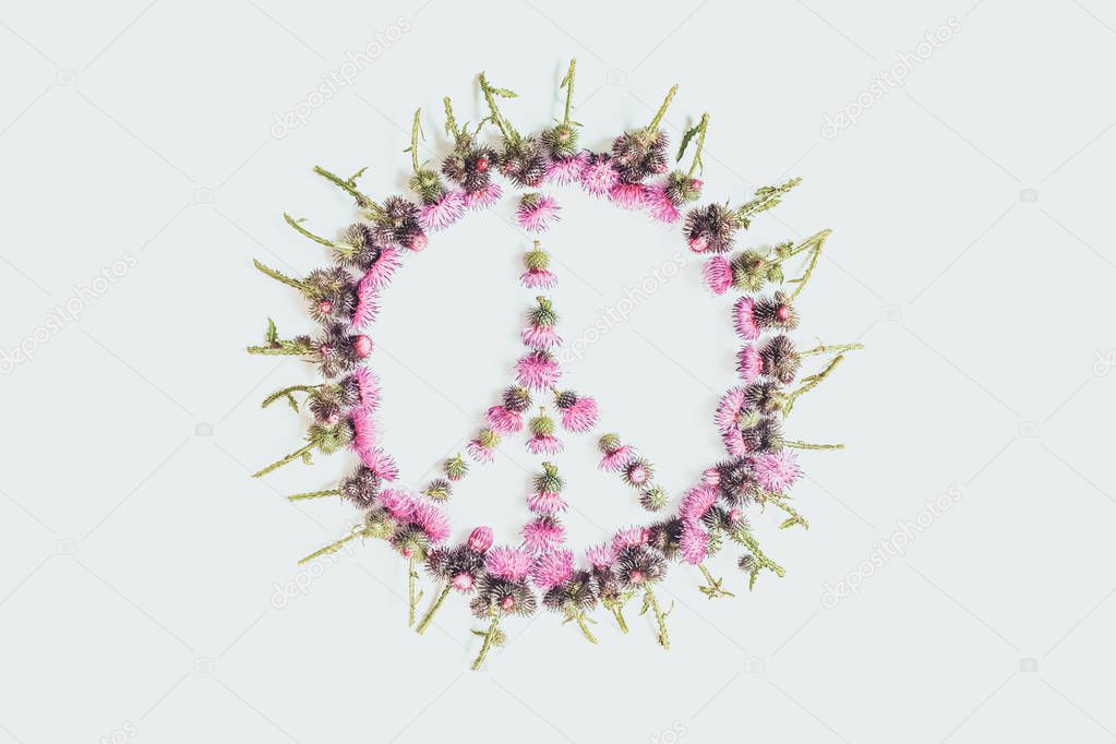 Peace sign (Pacific)-a symbol of peace, disarmament and anti-war movement, lined with delicate pink flowers blossomed Thistle.