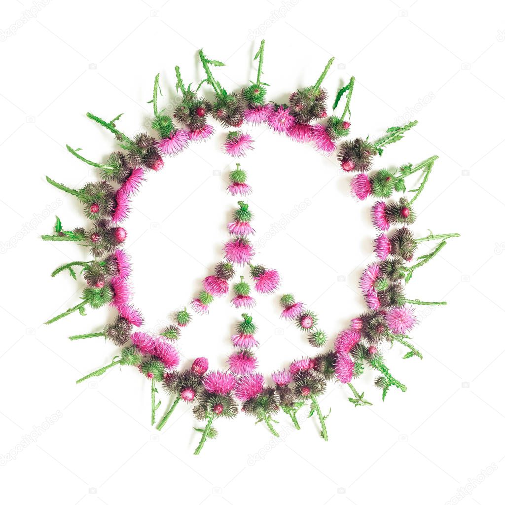 Peace sign (Pacific)-a symbol of peace, disarmament and anti-war movement, lined with delicate pink flowers blossomed Thistle.