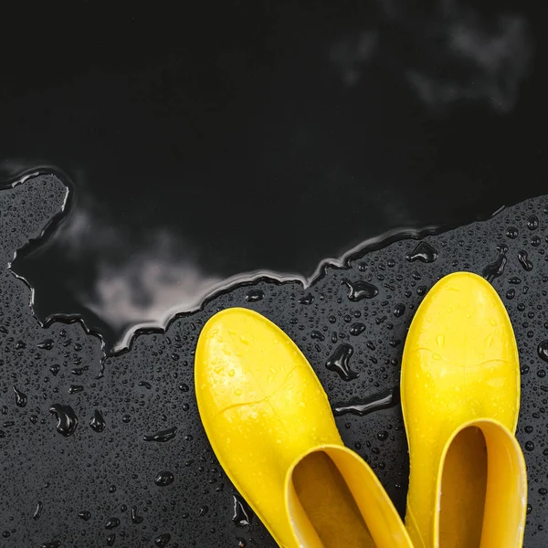 Women Bright Yellow Rubber Boots Stand Black Background Covered Raindrops — Stock Photo, Image