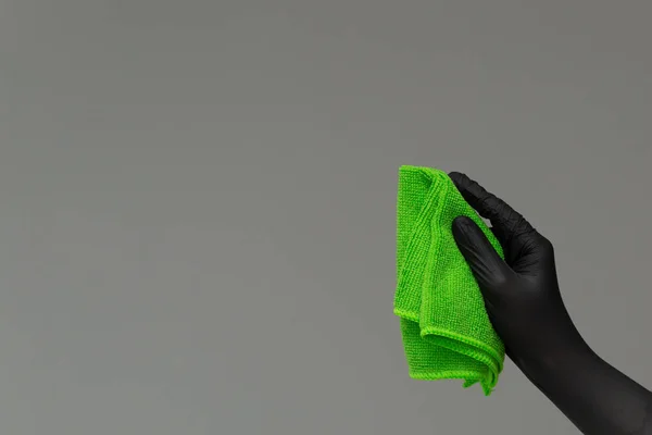 Hand Rubber Glove Holds Bright Microfiber Duster Neutral Background Spring — Stock Photo, Image