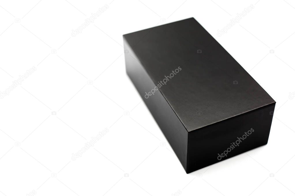 Closed black box of textured cardboard on white background. Isolated