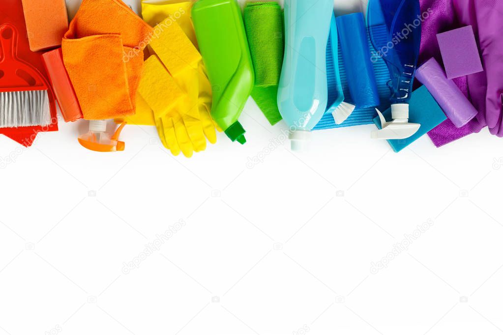 Colourful cleaning Products and tools isolated on white background. Flat lay. Spring cleaning concept.