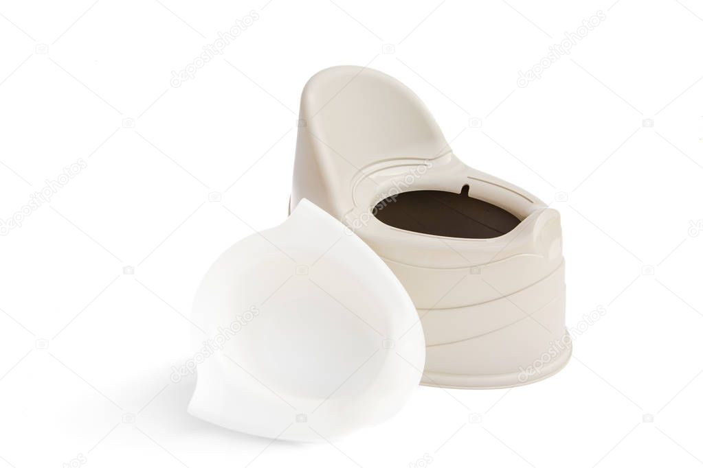 Baby potty beige color with removed inner bowl near isolated on white background
