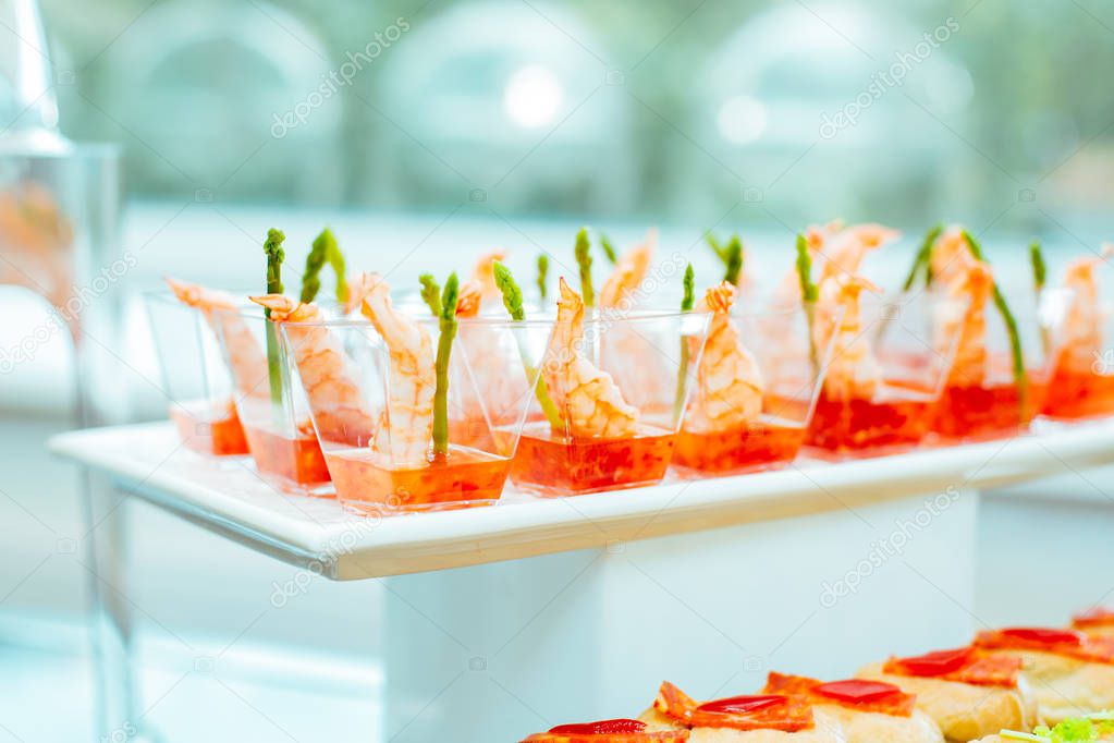 Food at the event: disposable plastic cups with snacks