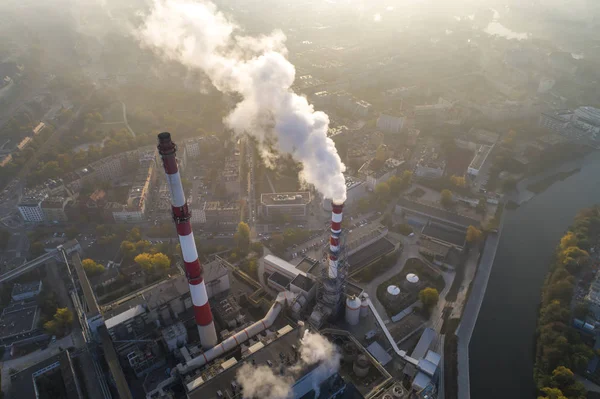 Aerial view of the smog over city, smoking chimneys of the CHP plant and the city\'s buildings - Wroclaw, Poland