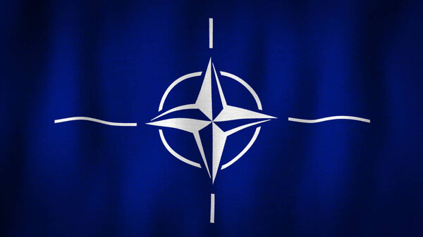 Флаг НАТО развевается на ветру. Флаг Североатлантического альянса с детальной текстурой