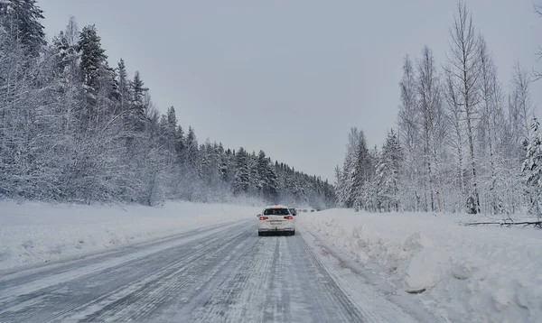 We drive in a magnificent winter landscape with icy roads and beautiful views. The road goes from Lule on the coast of Norrbotten to Jokkmokk in Swedish Lapland and on to a small lake far out in the wilderness — Stock Image Drive Magnificent Winter Landscape Icy Roads Beautiful Views Road Goes Royalty Free Stock Images