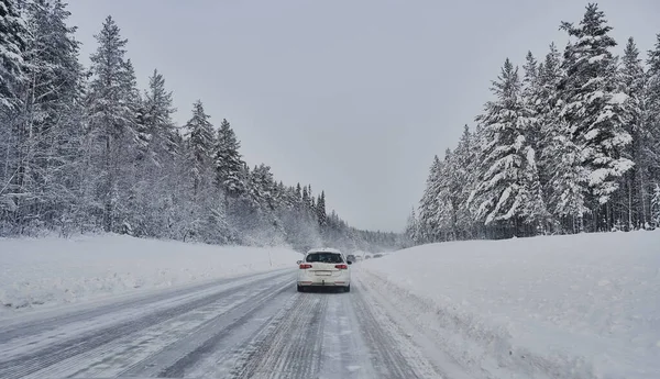 We drive in a magnificent winter landscape with icy roads and beautiful views. The road goes from Lule on the coast of Norrbotten to Jokkmokk in Swedish Lapland and on to a small lake far out in the wilderness — Stock Image Drive Magnificent Winter Landscape Icy Roads Beautiful Views Road Goes Royalty Free Stock Photos