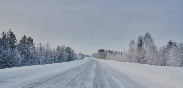 We drive in a magnificent winter landscape with icy roads and beautiful views. The road goes from Lule on the coast of Norrbotten to Jokkmokk in Swedish Lapland and on to a small lake far out in the wilderness — Stock Image Drive Magnificent Winter Landscape Icy Roads Beautiful Views Road Goes Royalty Free Stock Images
