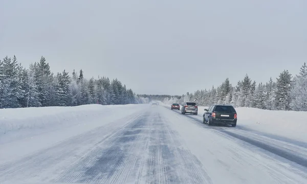 We drive in a magnificent winter landscape with icy roads and beautiful views. The road goes from Lule on the coast of Norrbotten to Jokkmokk in Swedish Lapland and on to a small lake far out in the wilderness — Stock Image Drive Magnificent Winter Landscape Icy Roads Beautiful Views Road Goes Royalty Free Stock Photos
