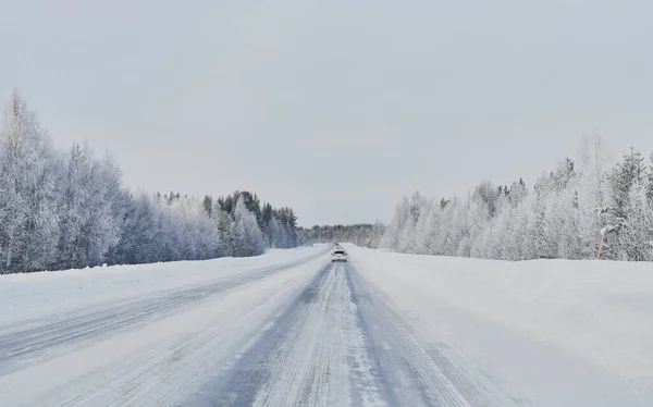 We drive in a magnificent winter landscape with icy roads and beautiful views. The road goes from Lule on the coast of Norrbotten to Jokkmokk in Swedish Lapland and on to a small lake far out in the wilderness — Stock Image Drive Magnificent Winter Landscape Icy Roads Beautiful Views Road Goes Royalty Free Stock Images
