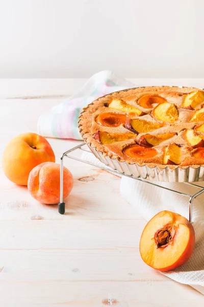 Peach pie in almond cream