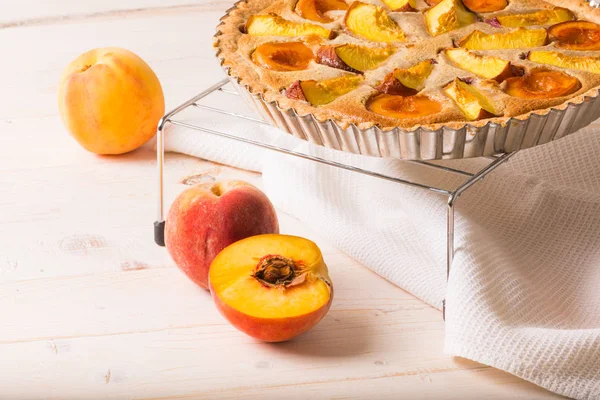 Peach pie in almond cream — Stock Photo, Image