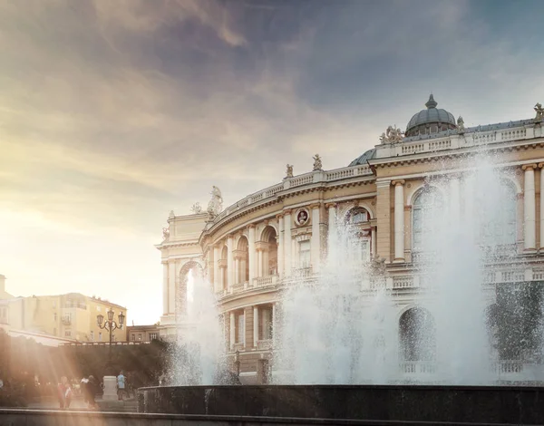 Odessa State Academic Opera and Ballet Theater. Beautiful theater building in classic style of a new Viennese baroque with fountains in the foreground at sunset