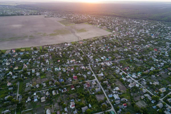 Aerial view of the fresh bright green lush countryside at sunset — Stock Photo, Image