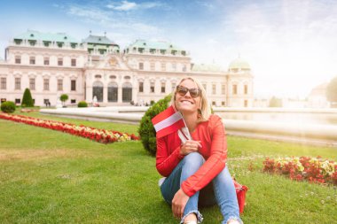 Female traveler on the background of Belvedere Palace complex of the 18th century in Vienna, Austria. clipart