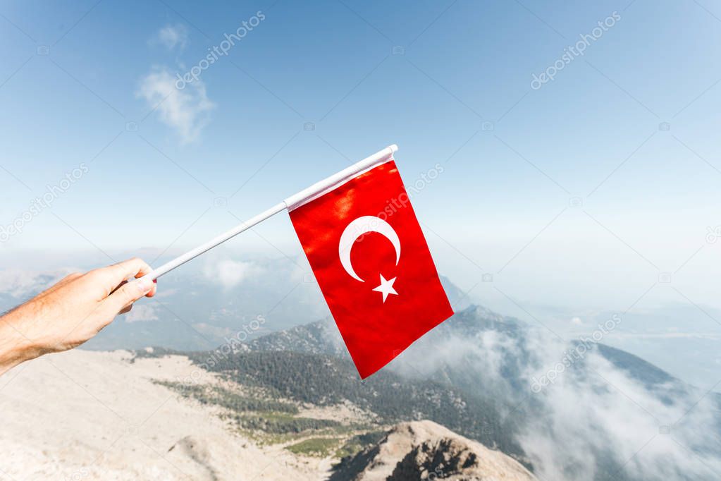 Flag of Turkey against the backdrop of Taurus Mountains