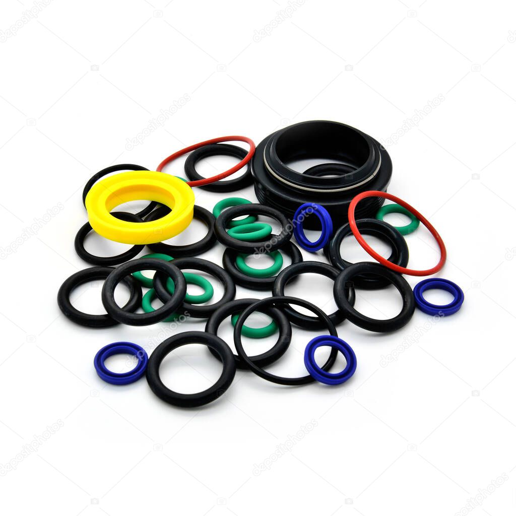 Seals, o-rings, dust wiper for mtb bikes and shock absorber. White background.