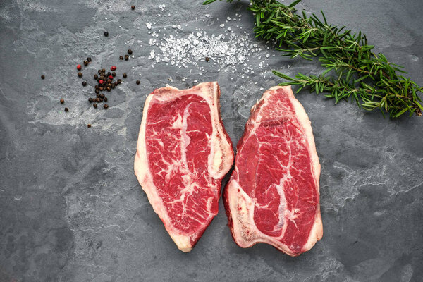 Top Blade steak dry-aged on stone background, top view