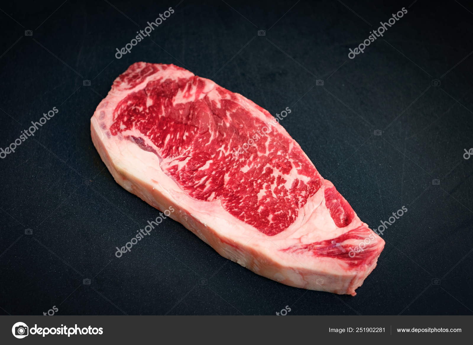 Fresh Marbled Beef Strip Loin Steak On A Black Background Stock Photo Image By C Hamonsemenovich