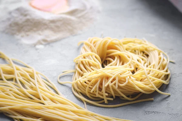 Fresh pasta on the table - spaghetti home made — Stock Photo, Image