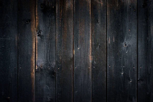 Black old wooden background with vertical boards — Stock Photo, Image