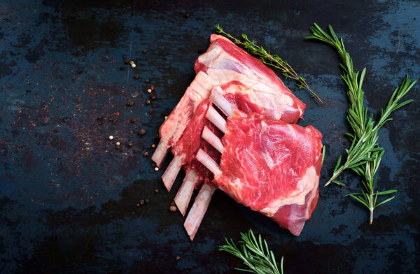Fresh lamb ribs on a dark background
