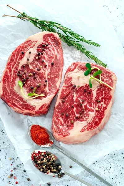 Two Raw Marbled Beef Steak Ribeye Spices White Kraft Paper — Stock Photo, Image