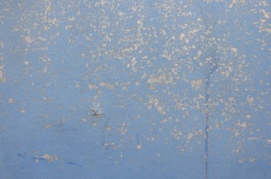 Çok renkli arka plan, paslı metal mavi boya dökülüyor ve çatlama doku